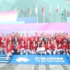 Các thành viên Đoàn Thể thao Việt Nam tham dự Lễ Thượng cờ tại ASIAD 19. (Ảnh: Hoàng Linh/TTXVN) 