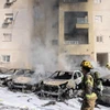 Xe ôtô bị cháy sau cuộc tấn công bằng rocket từ Dải Gaza tại Ashkelon, Israel, ngày 7/10. (Ảnh: AFP/TTXVN)