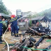 Lực lượng chức năng đã dập tắt vụ cháy nhà ở xã Phong Niên, huyện Bảo Thắng, tỉnh Lào Cai. (Nguồn: Báo Nhân dân)