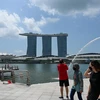 Khách du lịch tại Singapore. (Ảnh: AFP/TTXVN)