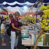 Du khách đến tham quan tại Lễ hội Đường sách Tết Quý Mão 2023, tại Thành phố Hồ Chí Minh. (Ảnh: Thu Hoài/TTXVN)