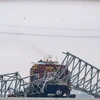 Tàu chở hàng Dali đâm sập cầu Francis Scott Key ở thành phố Baltimore, bang Maryland, Mỹ ngày 27/3 vừa qua. (Ảnh: AFP/TTXVN)