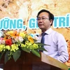 Ông Hoàng Xuân Tân, Phó Chủ tịch Ủy ban Nhân dân tỉnh Quảng Bình phát biểu tại hội nghị. (Ảnh: Võ Dung/TTXVN)