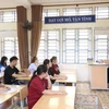 Các thí sinh nghe phổ biến quy chế thi Kỳ thi tốt nghiệp THPT 2024 tại điểm thi Trường THPT chuyên Chu Văn An, thành phố Lạng Sơn. (Ảnh: Anh Tuấn/TTXVN)