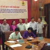 Lễ ký kết chương trình hợp tác giữa Bảo hiểm xã hội Việt Nam và Tổng Liên đoàn Lao động Việt Nam. (Ảnh: PV/Vietnam+)