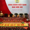 Đoàn chủ tịch điều hành phiên khai mạc Đại hội XII Công đoàn Việt Nam. (Ảnh: TTXVN)