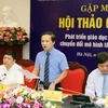 Phó Chủ nhiệm Ủy ban Văn hóa, Giáo dục, Thanh niên, Thiếu niên và Nhi đồng Phạm Tất Thắng giới thiệu về hội thảo. (Ảnh: PV/Vietnam+)