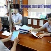 Giải quyết chế độ hưu trí cho người lao động. (Ảnh: Vietnam+)