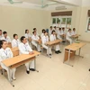 Các ứng viên điều dưỡng Việt Nam học tiếng Nhật trước khi sang nước bạn làm việc. (Ảnh: PV/Vietnam+)
