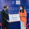 Ký kết tài trợ dự án hỗ trợ lao động nữ trong các khu vực phi chính thức tại Đà Nẵng và Huế. (Ảnh: PV/Vietnam+)