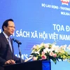 Bộ trưởng Bộ Lao động-Thương binh và Xã hội Đào Ngọc Dung phát biểu tại buổi toạ đàm. (Ảnh: PV/Vietnam+)