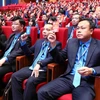 Các đại biểu tham gia biểu quyết tại Đại hội XIII Công đoàn Việt Nam. (Ảnh: TTXVN)