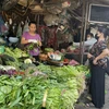 Giá thực phẩm tại các chợ vẫn tương đối ổn định. (Ảnh: PV/Vietnam+)