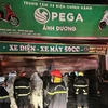 Vụ cháy làm 3 người thiệt mạng tại cửa hàng kinh doanh xe đạp, xe máy điện tại Hà Nội. (Ảnh: Mạnh Khánh/TTXVN)