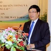 Phó Thủ tướng, Bộ trưởng Ngoại giao Phạm Bình Minh phát biểu tại hội thảo. (Ảnh: TTXVN),