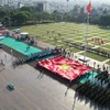 Lễ thượng cờ trang nghiêm tại quảng trường thành phố Pleiku (Ảnh: Lâm Phan/Vietnam+) 