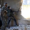 Phiến quân nổ súng vào quân chính quyền Syria ở Aleppo. (Nguồn: Telegraph)