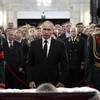 Bức ảnh cho thấy ông Putin thể hiện sự đau buồn trong lễ tang của ông Karlov. (Nguồn: Sputnik)