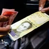 Đồng bolivar của Venezuela. Đất nước này sắp có thêm đồng tiền điện tử ​Petro. (Ảnh Reuters)