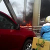 Cháy xe ôtô trên cầu Chương Dương vào giờ cao điểm