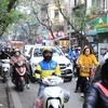 Nhịp sống hối hả ở Thủ đô Hà Nội khi Tết Nguyên đán 2024 cận kề