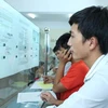 Thí sinh làm thủ tục xét tuyển tại Đại học Công nghiệp Hà Nội. (Ảnh: Lê Minh Sơn/Vietnam+)