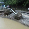 Đường Quốc lộ 4D Lai Châu-Lào Cai đoạn qua bản Chu Va 12, xã Sơn Bình, huyện Tam Đường bị hư hỏng nặng. (Ảnh: Quý Trung/TTXVN)