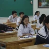 Thí sinh dự thi môn Ngữ văn, Kỳ thi Tuyển sinh vào lớp 10 năm học 2019-2020, tại điểm thi Trường Trung hoc cơ sở Phan Chu Trinh. (Ảnh: Đình Tùng/Vietnam+)