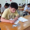 Thí sinh dự thi môn Ngữ văn tại điểm thi Trường Trung học phổ thông Việt Đức, Hà Nội. (Ảnh: Phạm Mai/Vietnam+)