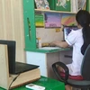 Học sinh Hà Nội thi trực tuyến với sự giám sát của giám thị qua camera. (Ảnh: CTV/Vietnam+)