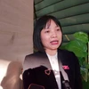 Đại biểu Quốc hội Nguyễn Thị Việt Nga chia sẻ với báo chí bên hành lang Quốc hội. (Ảnh: Minh Thu/Vietnam+)