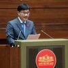 Chủ nhiệm Ủy ban Kinh tế Vũ Hồng Thanh trình bày báo cáo thẩm tra. (Ảnh: CTV/Vietnam+)