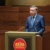 Bộ trưởng Bộ Công An Tô Lâm trình bày báo cáo trước Quốc hội. (Ảnh: CTV/Vietnam+)