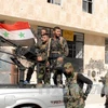 Binh sĩ chính phủ Syria trung thành với ông Al-Assad (Nguồn: AFP/TTXVN)