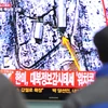 Người dân Hàn Quốc theo dõi thông tin về tinh hình hạt nhân Triều Tiên trên truyền hình (Nguồn: AFP)