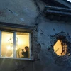 Một ngôi nhà bị dính đạn pháo trong các cuộc giao tranh ở Ukraine. (Nguồn: AFP)