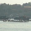 Lễ hội đua thuyền truyền thống trên sông Nhật Lệ. (Ảnh: Đức Thọ/TTXVN)