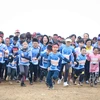 Nhân viên Tập đoàn TH và gia đình cùng tham gia giải chạy Run to the Sun ngày 8/1. (Ảnh: Tá Hiển/Vietnam+)