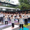 Hoạt động hưởng ứng Ngày Quốc tế Yoga lần thứ 10 diễn ra tại Bảo tàng Phụ nữ Việt Nam, Hà Nội. (Ảnh: Minh Thu/Vietnam+)