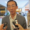 Đại biểu Quốc hội Trần Hoàng Ngân đang trả lời báo chí (Ảnh: Đức Duy/Vietnam+)