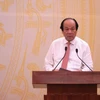 Bộ trưởng Chủ nhiệm Văn phòng Chính phủ Mai Tiến Dũng chủ trì phiên họp báo. (Ảnh: PV/Vietnam+)