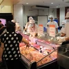 Nhiều doanh nghiệp cam kết đảm bảo bình ổn giá thịt lợn trong dịp Tết. (Ảnh: Đức Duy/Vietnam+)