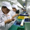 Doanh nghiệp đầu tư công nghệ đón đầu các hiệp định thương mại mới. (Ảnh: Xuân Quảng/Vietnam+)