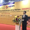 Bộ trưởng Bộ Công Thương Trần Tuấn Anh phát biểu tại Triển lãm quốc tế về công nghiệp hỗ trợ và chế biến, chế tạo sáng 9/12. (Ảnh: Đức Duy/Vietnam+)