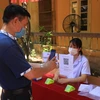 Hà Nội kêu gọi người dân thực hiện khai báo y tế thường xuyên để phòng, chống dịch COVID-19. (Ảnh: Xuân Quảng/Vietnam+)