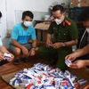 Lực lượng chức năng tạm giữ hàng trăm hộp thuốc điều trị COVID-19 không rõ chất lượng trên địa bàn Hà Nội. (Ảnh: PV/Vietnam+)