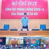 Ông Dương Đức Tuấn, Phó Chủ tịch UBND thành phố Hà Nội họp với các đơn vị về công tác phòng, chống COVID-19. (Ảnh: PV/Vietnam+)