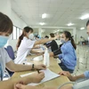 Tiêm chủng vaccine phòng COVID-19 tại khu công nghiệp Nội Bài. (Ảnh: Minh Quyết/TTXVN)