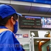 Một cửa hàng của Petrolimex chuẩn bị niêm yết giá bán xăng dầu mới. (Ảnh: PV/Vietnam+)