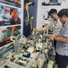 Các doanh nghiệp tham gia tại hội chợ sản phẩm công nghiệp, máy móc thiết bị và tự động hóa Hà Nội năm 2023. (Ảnh: Xuân Quảng/Vietnam+)